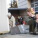 Micro-home being transported onto a trailer.