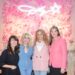 Charlotte Poling, left, Dolly Parton, Jamie Reschke, and Dr. Candice McQueen, right, pose together at the exhibit