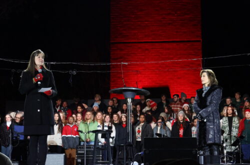 Lipscomb president Dr. Candice McQueen on stage with Amy Grant at Lighting of the Green in 2023