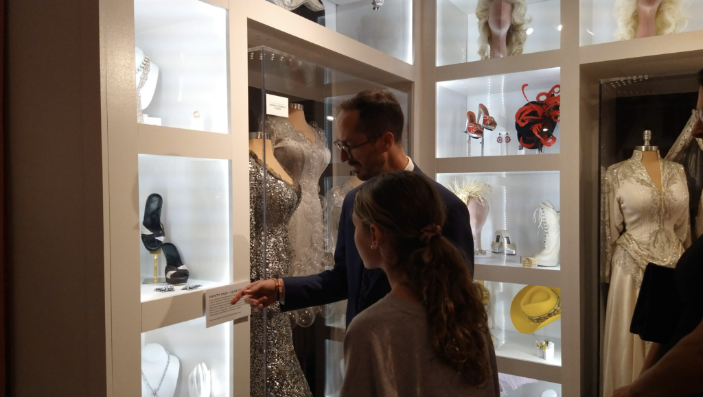 Nashville mayor Freddie O'Connell showing his daughter a piece from the exhibition