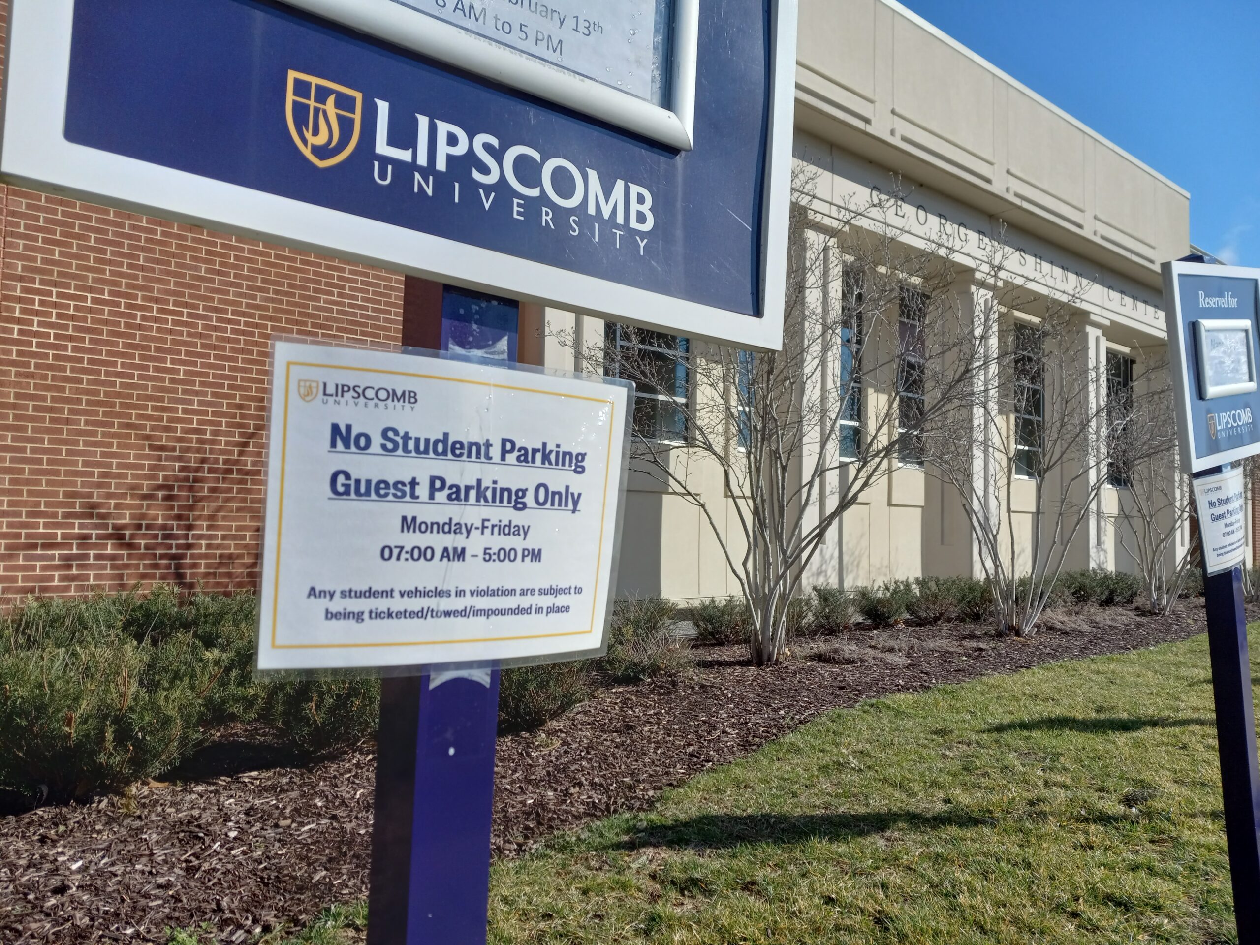 'No Student Parking' sign