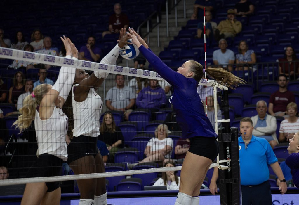 Jr. Kelsey Schenck winning the joust at the net.