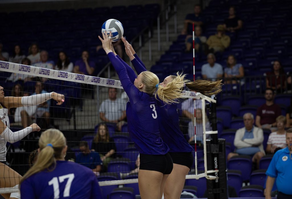 So. Sydney Strenger and Jr. Kelsey Schenck set up the block